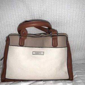 Handbag, a lot of storage on sides and middle, also zippers